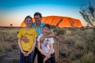 mum and boys in front of uluru